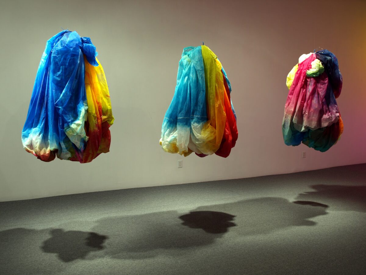 Suspended sculptures made of fabric with colorful dyes