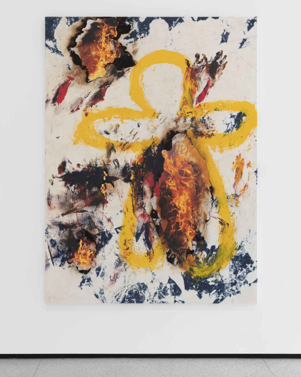 A painting of a yellow outline of a body with a background of a burning canvas and paint splotches.