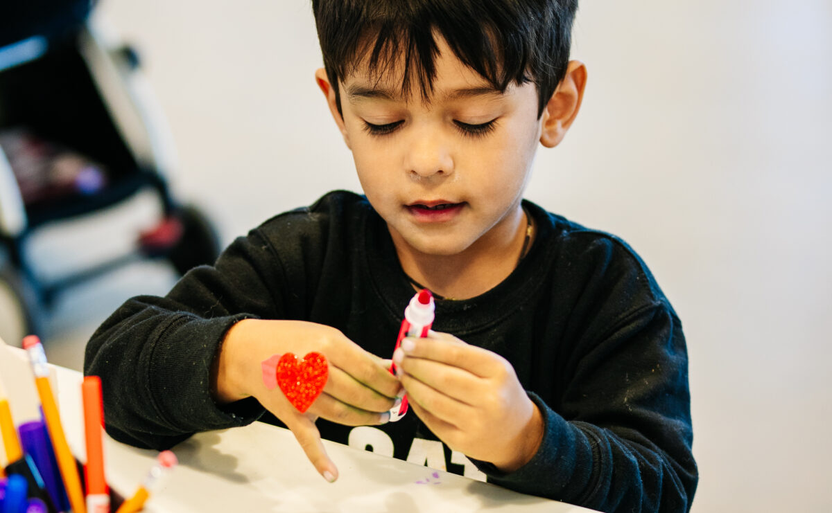 A child making art.