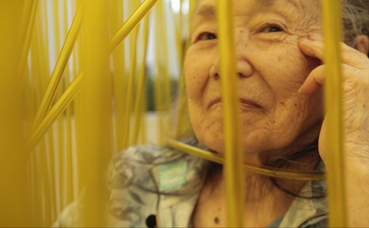 A still of a Japanese older woman form the film Wisdom Gone WIld.