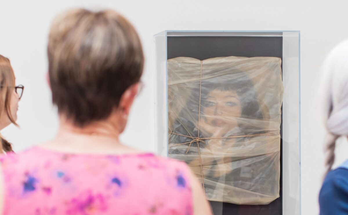 Image of four woman looking at an artwork