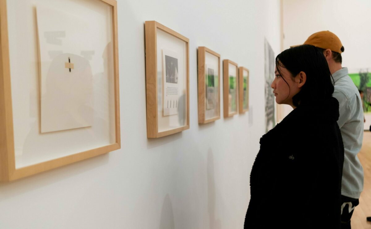 A person observes one of Álvarez Muñoz's photography pieces in her Enlightenment collection.