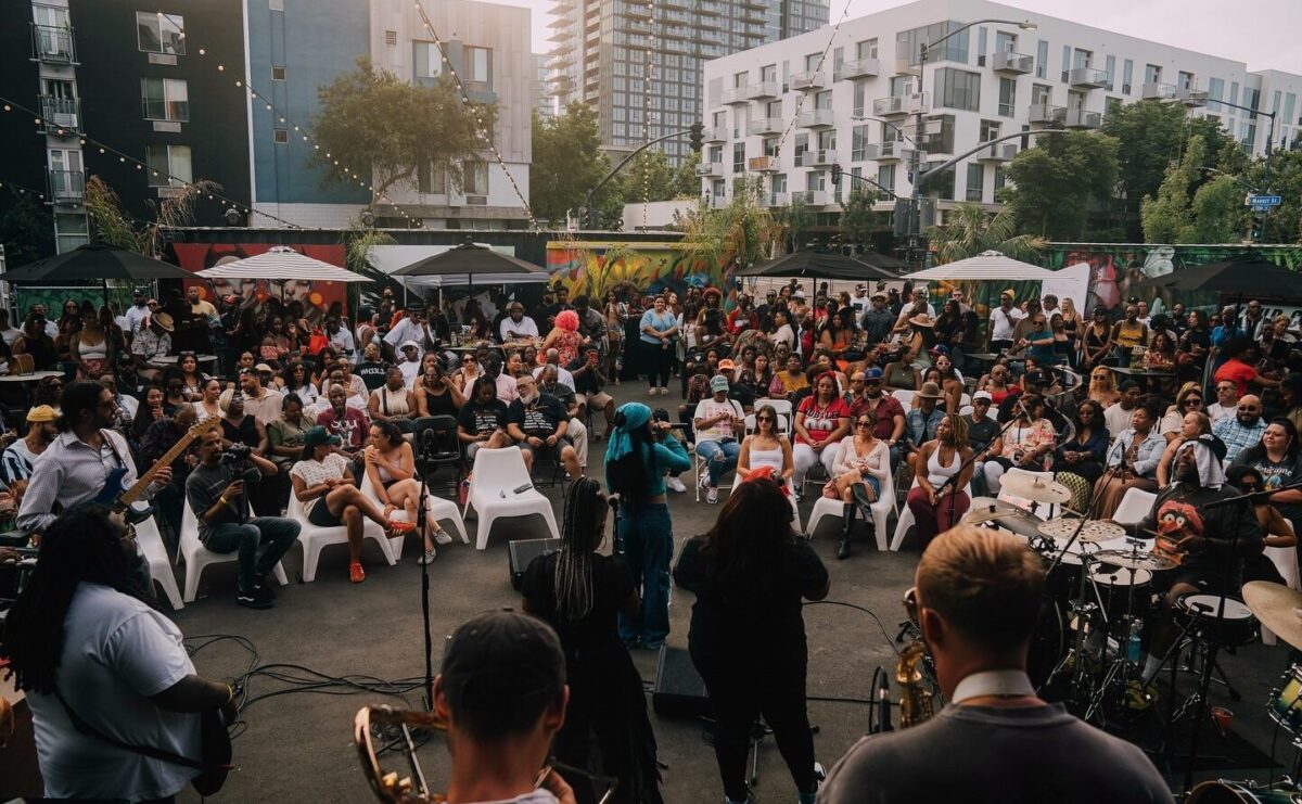 People listen to the Soul Sunday band performing.