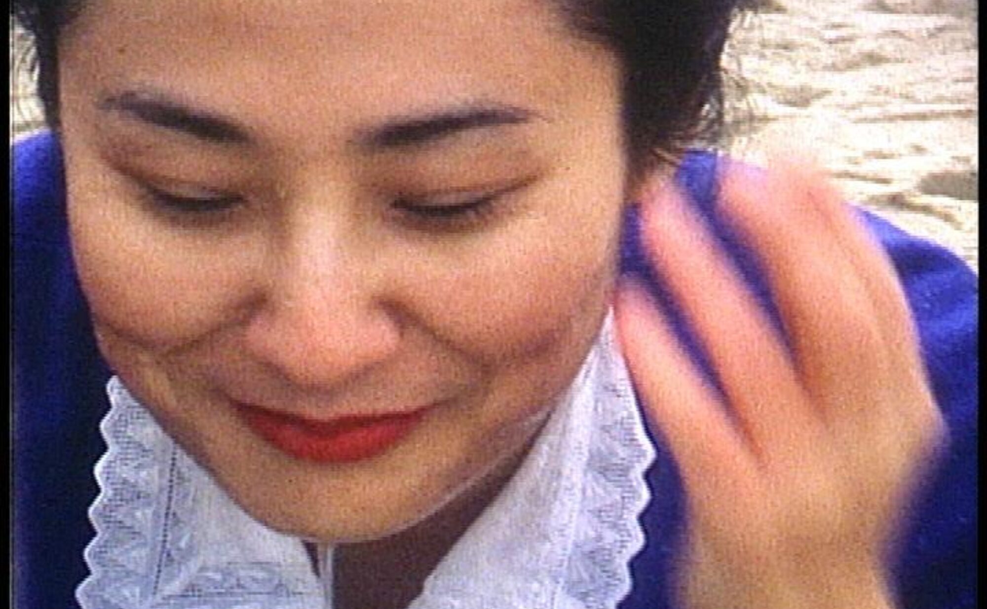 A close up of a Japanese woman smiling