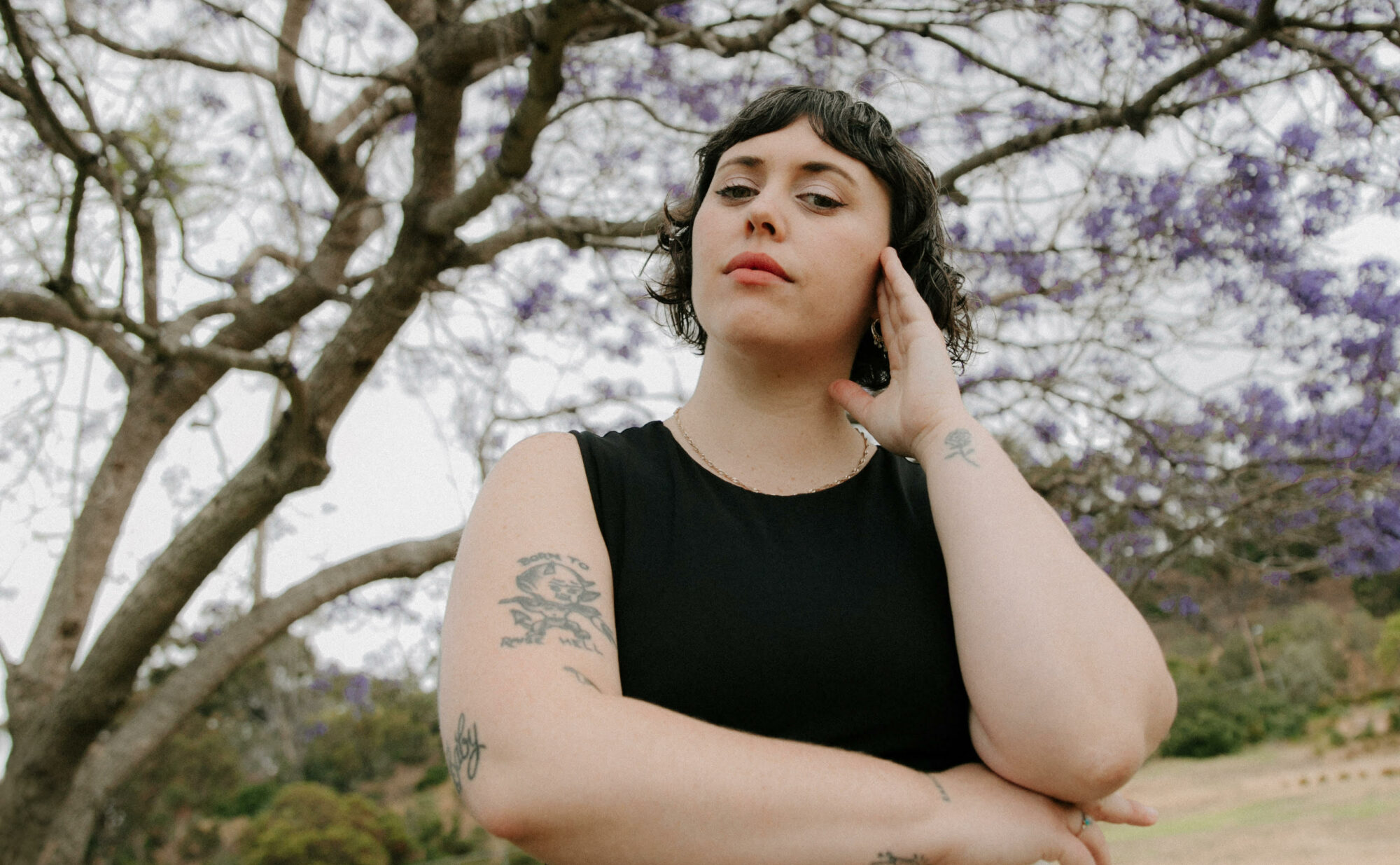 Person surrounded by leafless trees