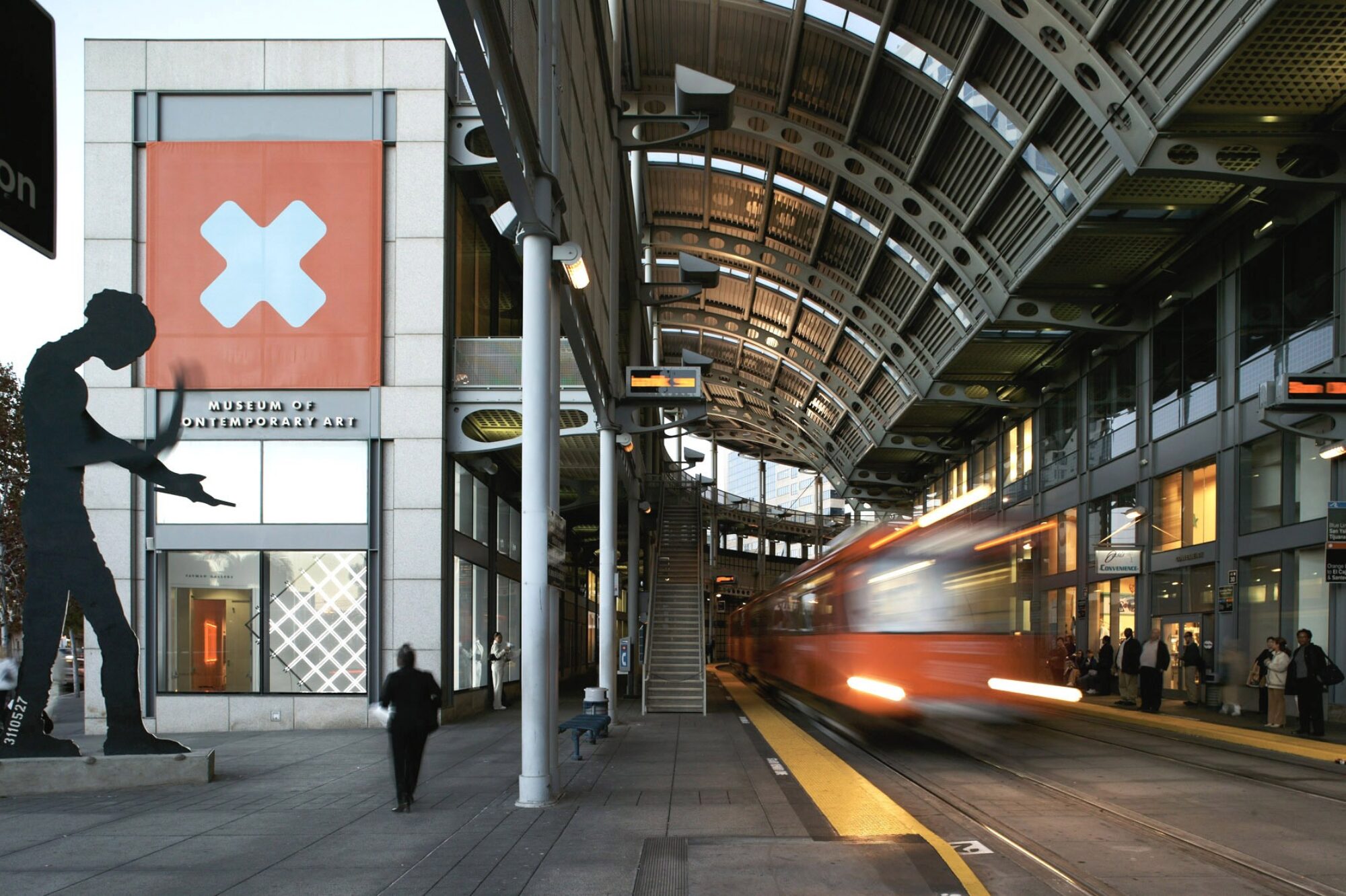 A trolly arrives, ready to load a crowd of transporters.