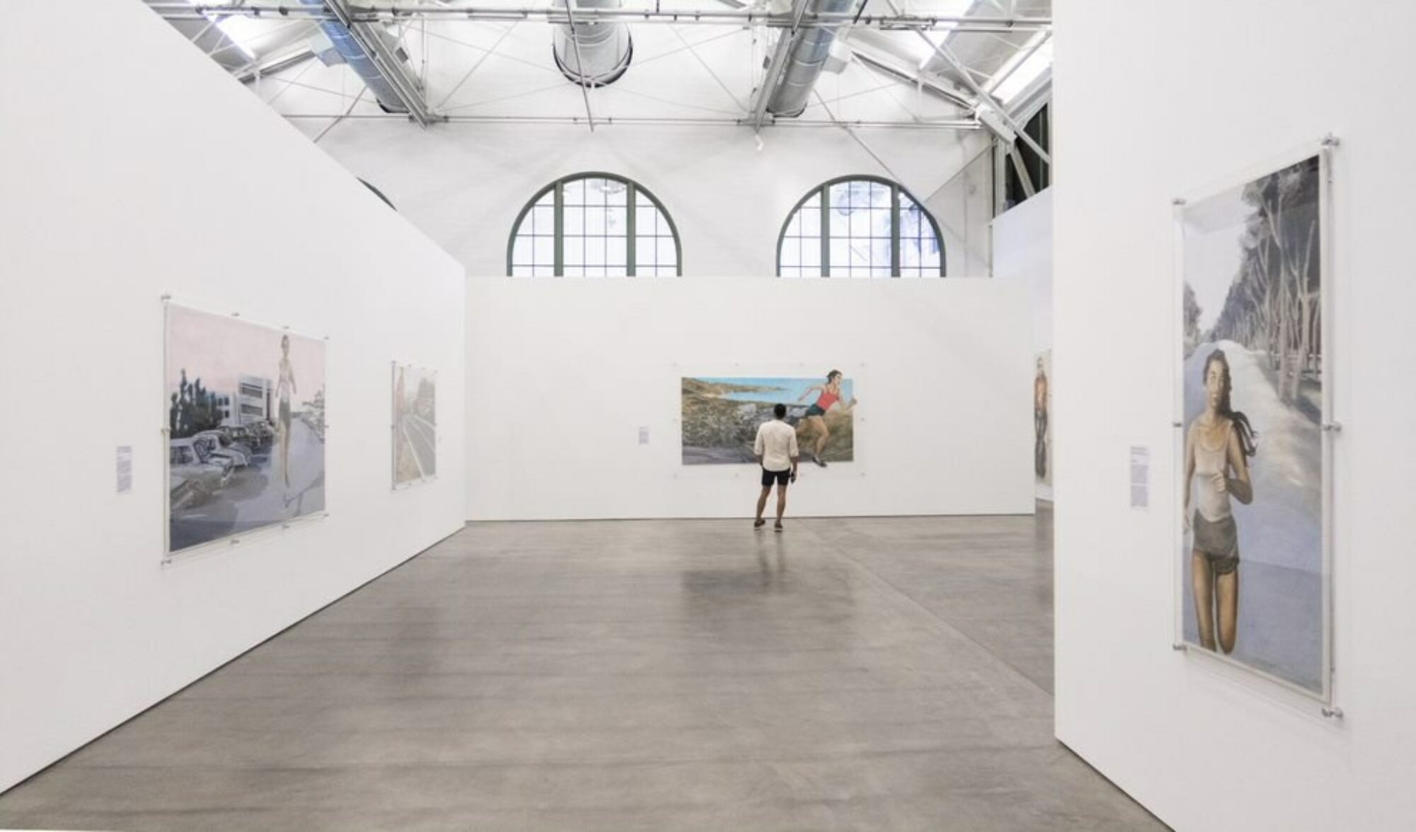 A visitor stands alone enjoying the large scale works of Yolanda Lopez inside MCASD downtown.