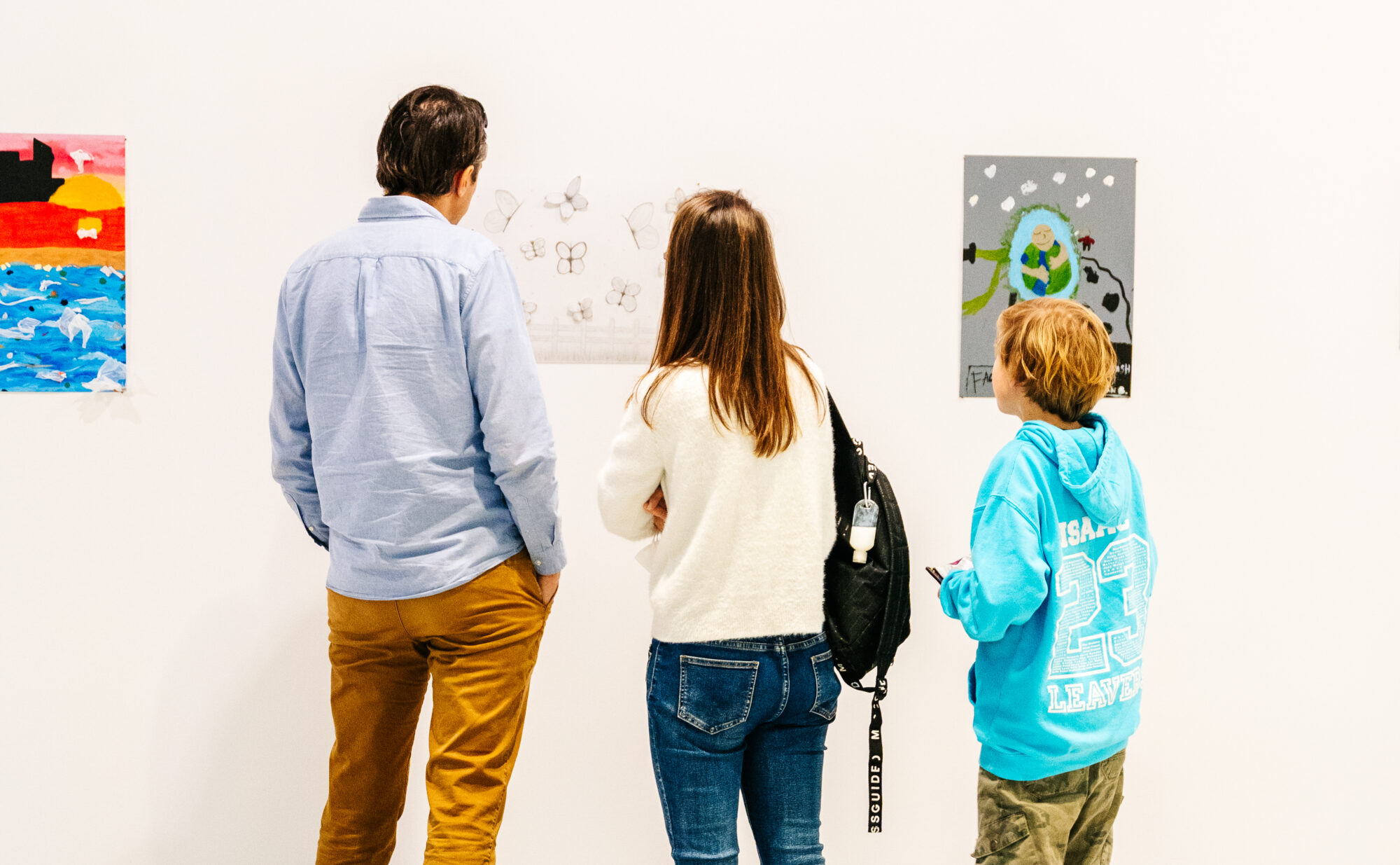 People looking at artwork.