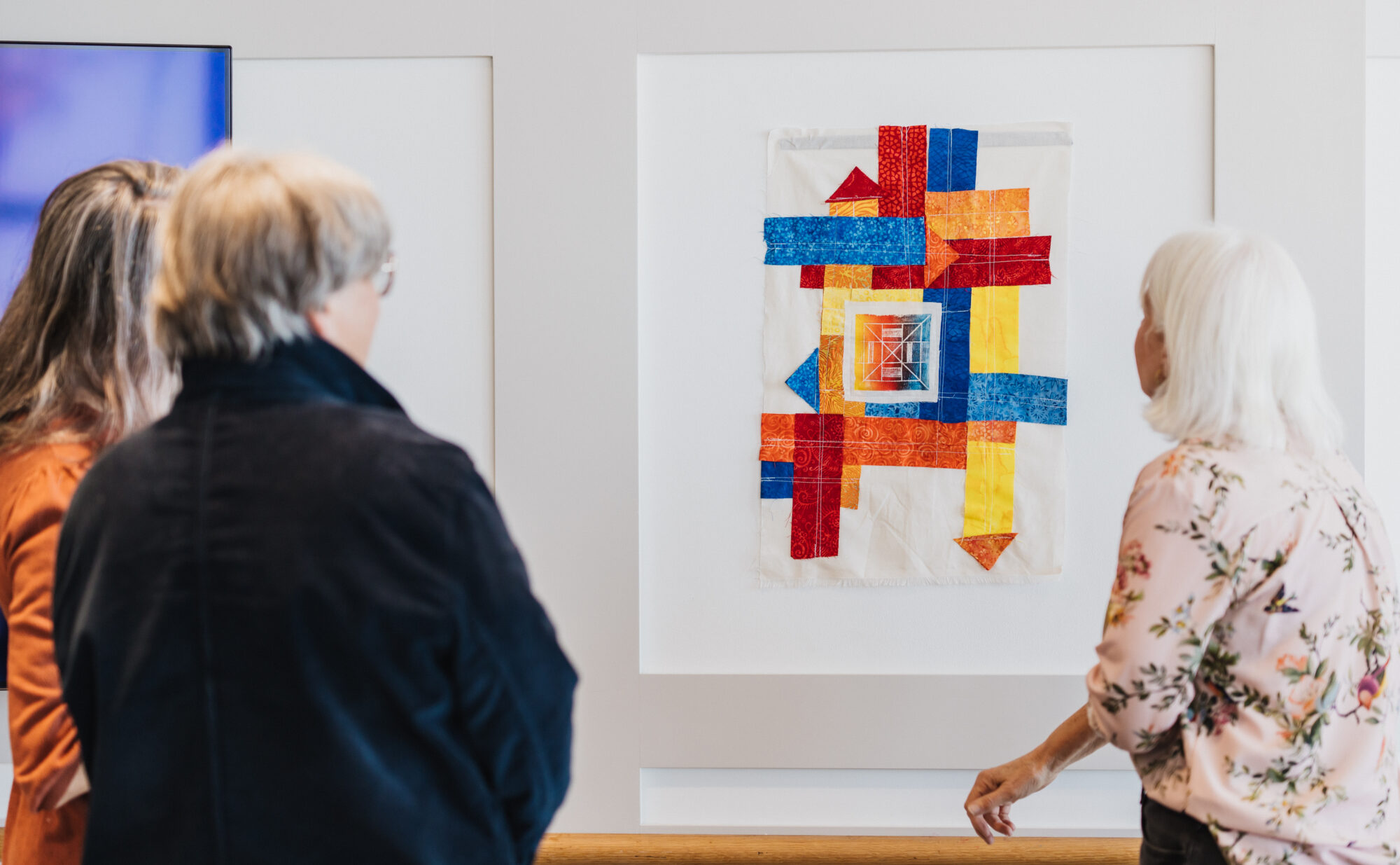 People looking at DIY art.