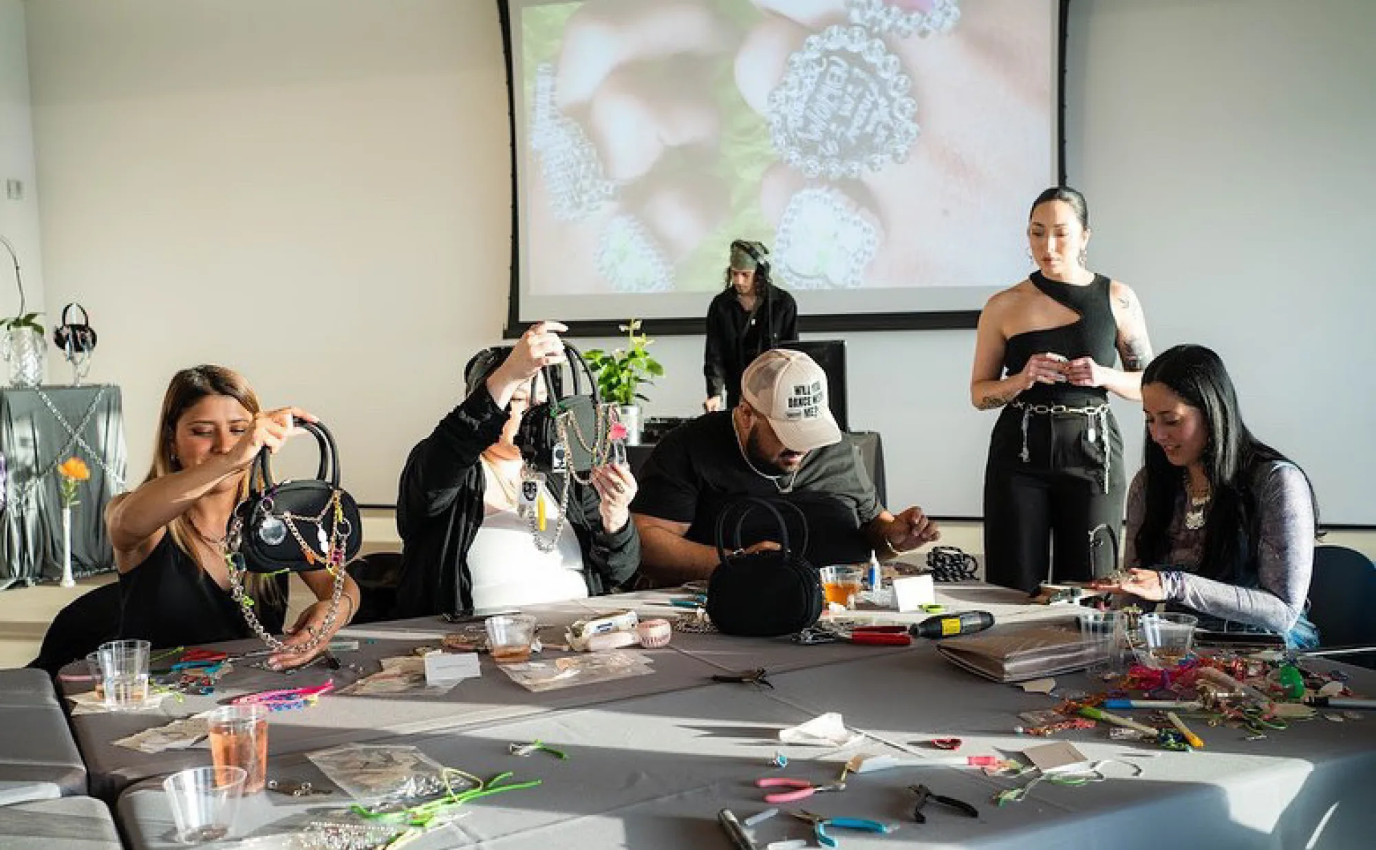People making contemporary purses.