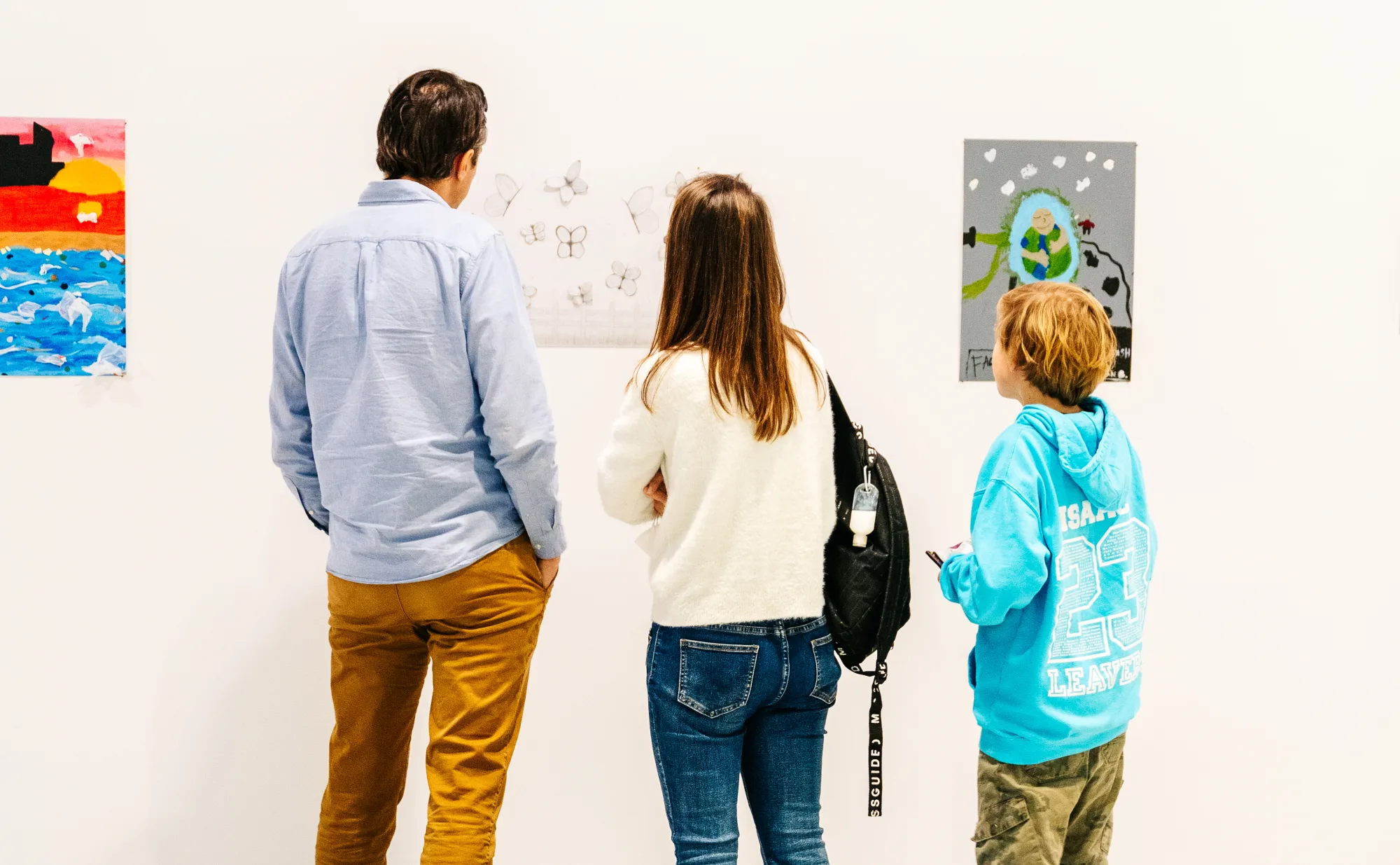 People looking at artwork.