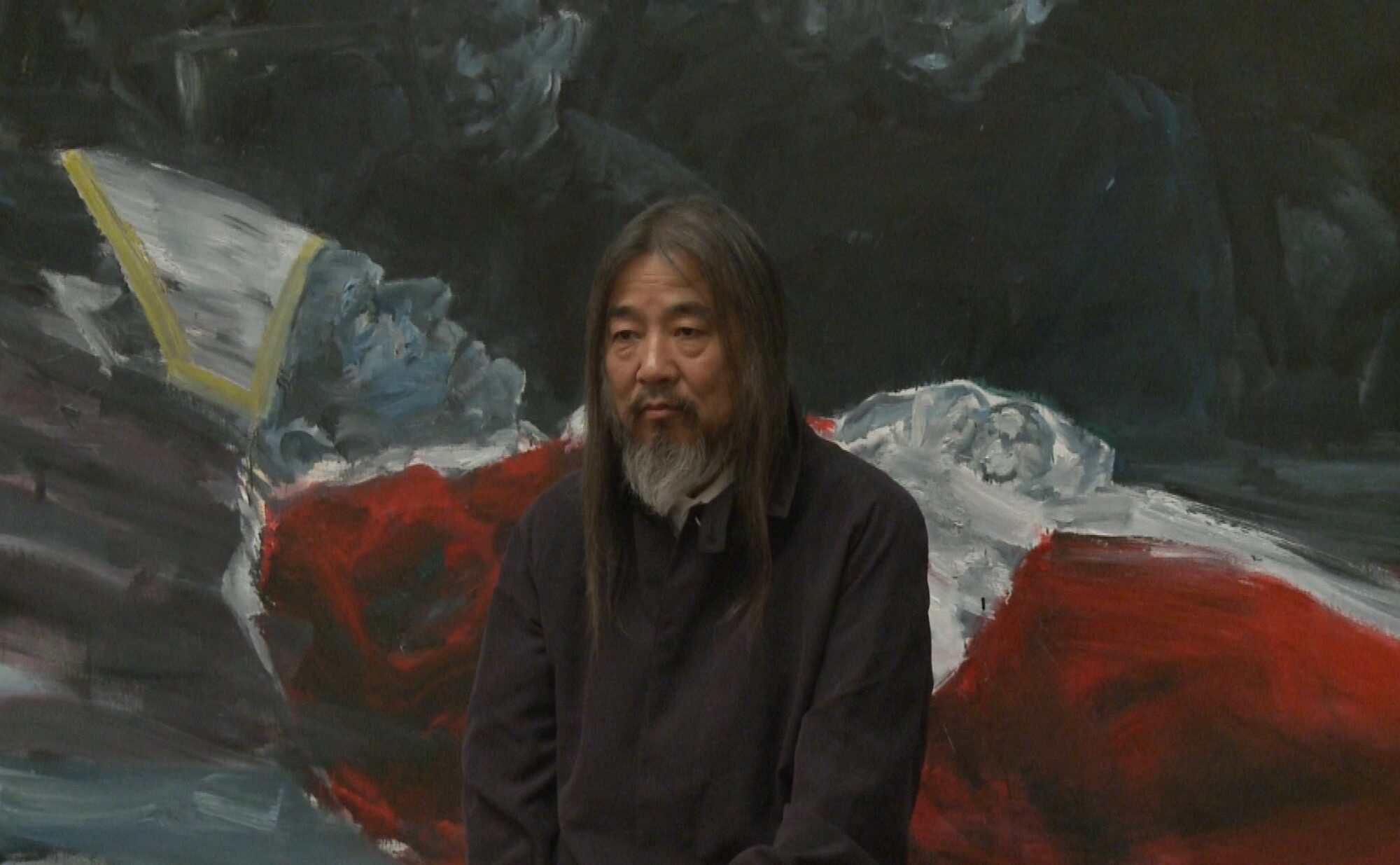Yean Pei-Ming in front of a large canvas